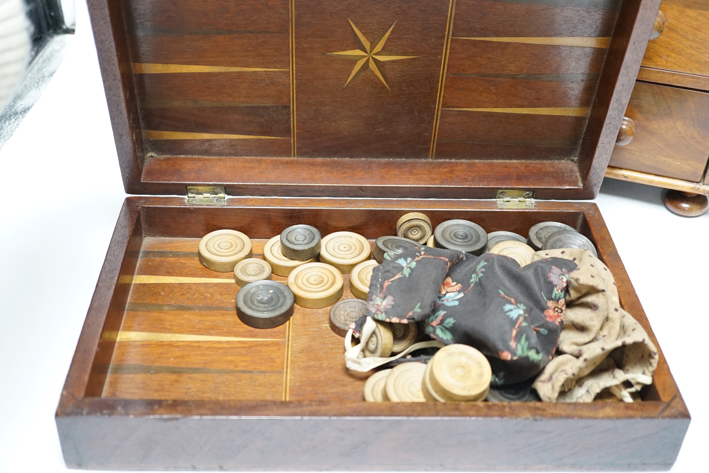 A Victorian mahogany miniature four draw chest, an amboyna glove box and a games box